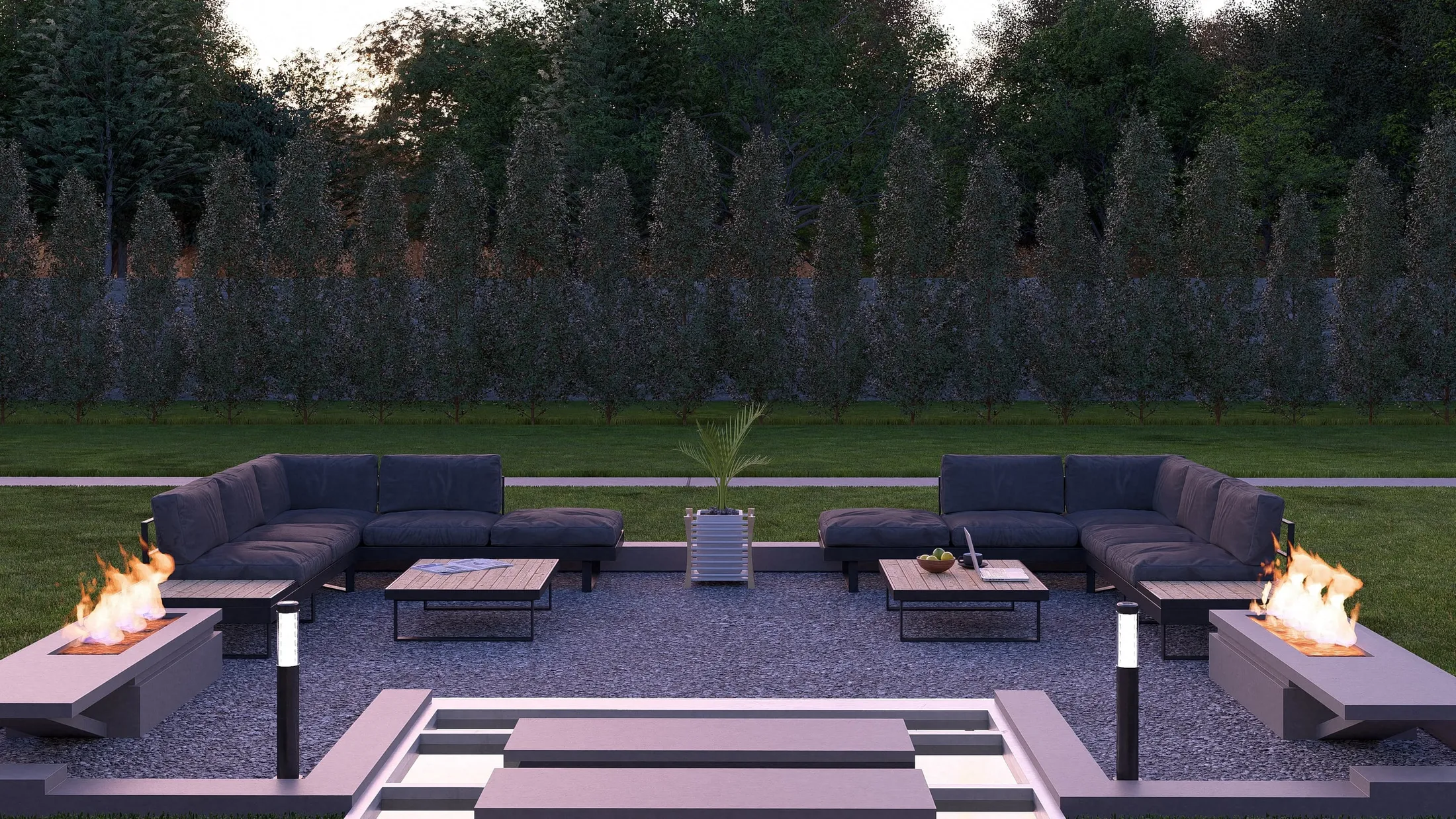 Sunken lounge at dusk with the fire pits lit